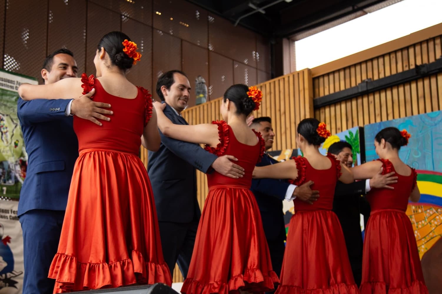 Peru Baila dancers performing together in red dresses