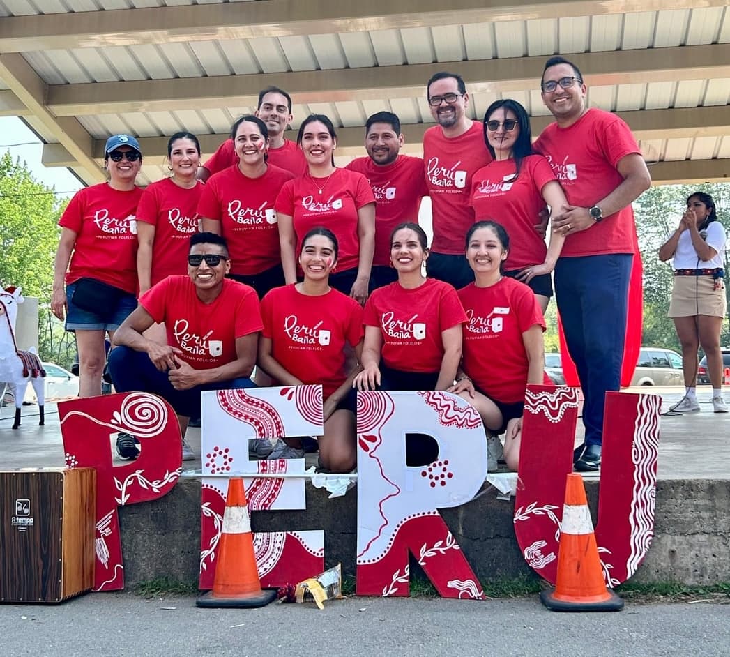 Peru Baila team members gathered at a community event