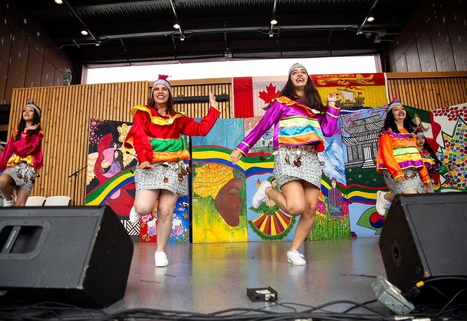 Peru Baila dancers performing in colorful traditional costumes