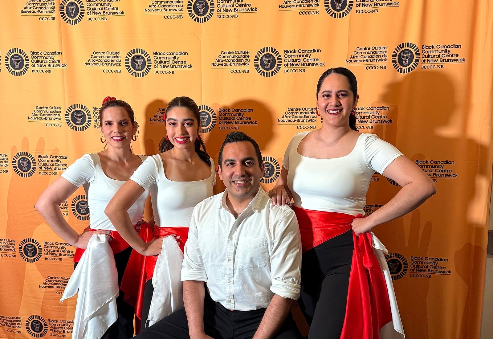 Peru Baila performers posing together after a cultural event