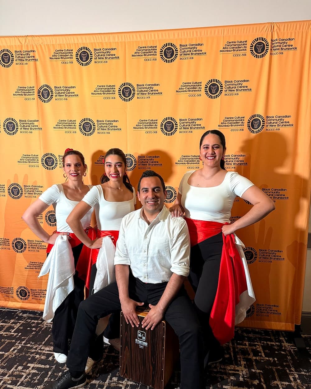 Peru Baila performers posing together after a cultural event