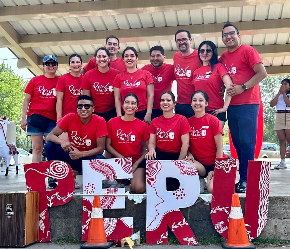 Peru Baila troupe members gathered at a community event