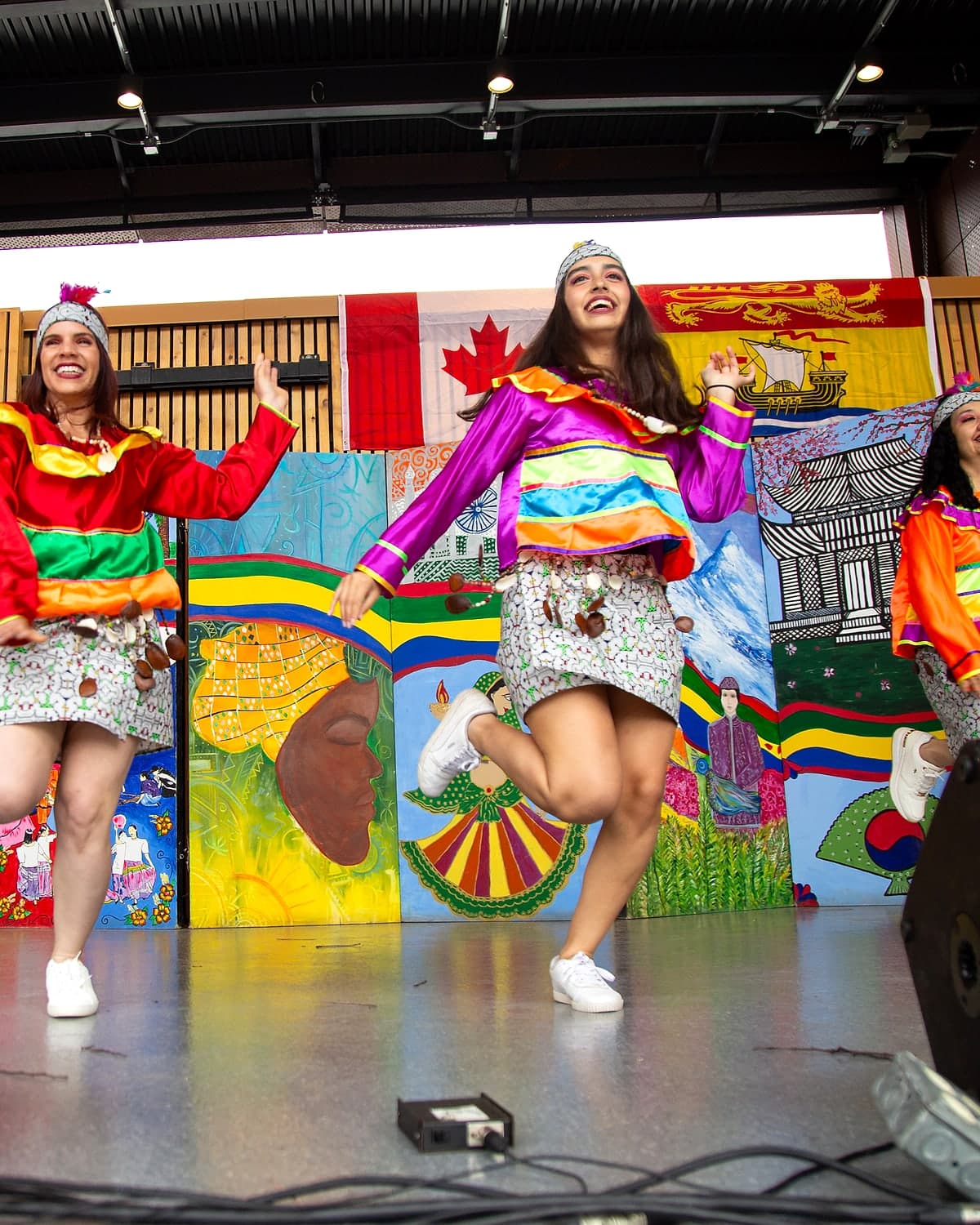 Peru Baila dancers in colorful Andean-inspired costumes